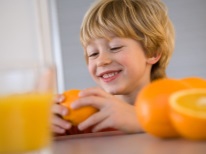 Baby with oranges