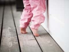 Why does a child walk on socks and what to do?