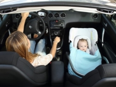 Is it possible to carry a child in the car seat in the front seat?