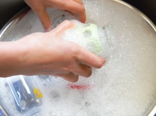 Washing the bottles with soapy water