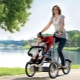 Bike with a stroller for mom and baby: features and tips for choosing