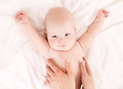 Massage the baby’s belly in a clockwise direction.