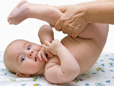 Pediatrician examines a newborn