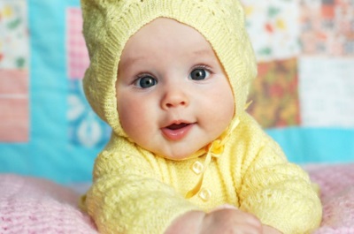 Beautiful baby in yellow clothes