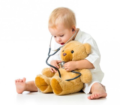 Boy playing doctor with toy