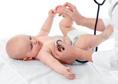 Doctor examines a newborn