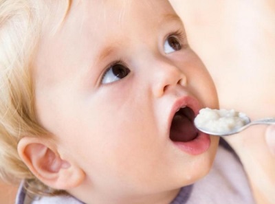 Child eats cottage cheese