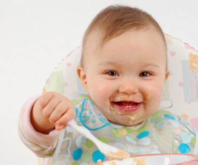 Baby eats porridge