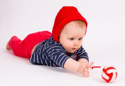 Baby reaching for toys