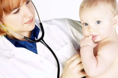 Pediatrician examines a baby