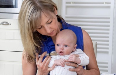 Syringe without a needle with saline when vomiting a child