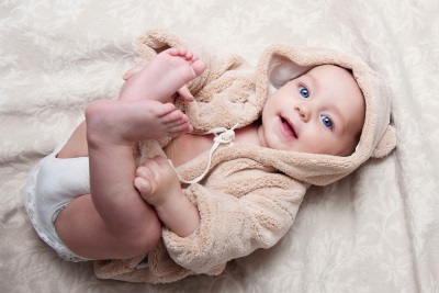 Beautiful baby lying on the bed