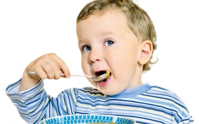 Baby eating food with ginger