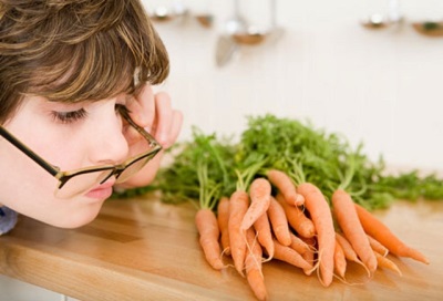 The boy looks bad - look at the carrots