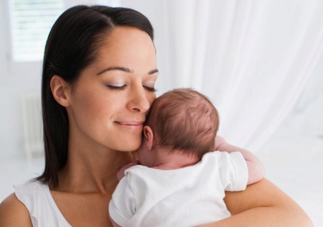 Mom hugs baby